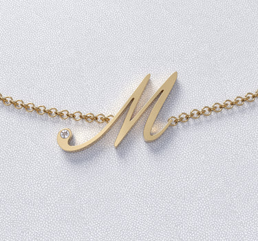 Colgante personalizado M con diamante, oro